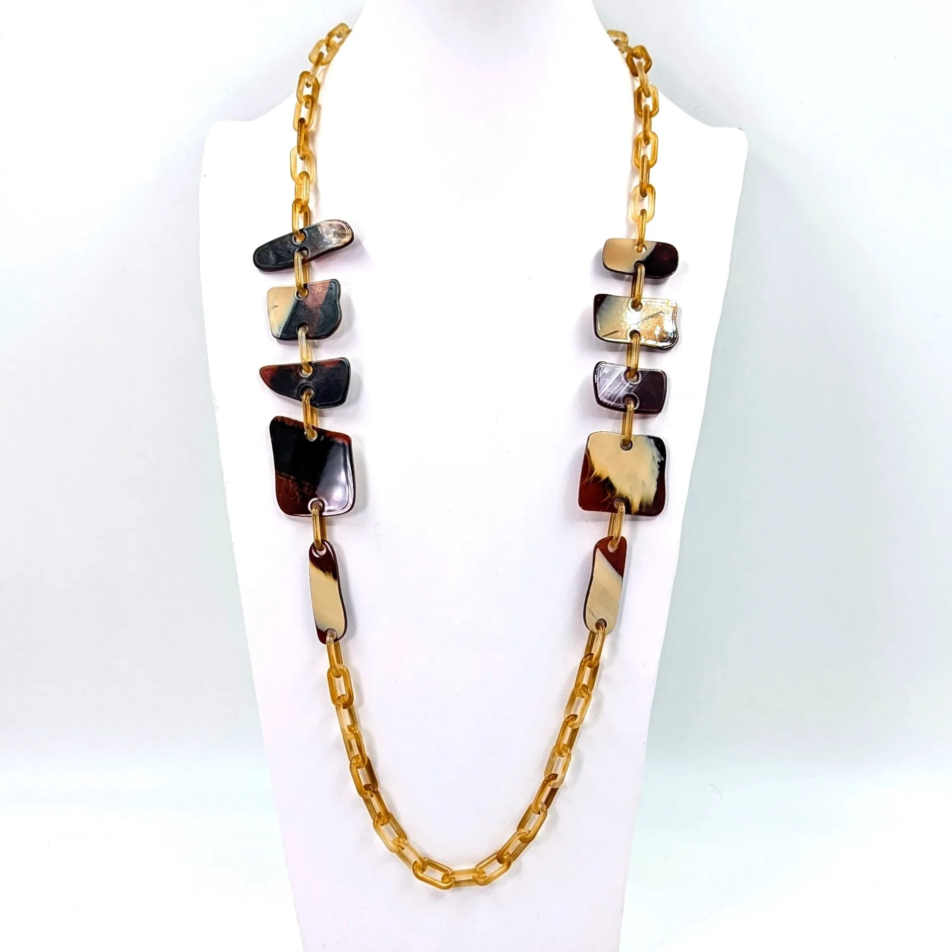 Flat rounded square resin shapes on long resin chain necklace
